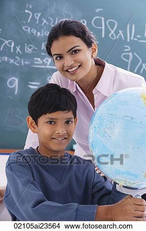 teacher and student with globe View Large Photo Image Picture - teacher and student with globe. Fotosearch