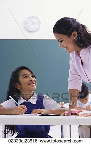 teacher smiles down at student View Large Photo Image Stock Photograph - teacher smiles down at student. Fotosearch