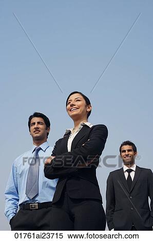 Stock Photography - three business colleagues, standing. Fotosearch