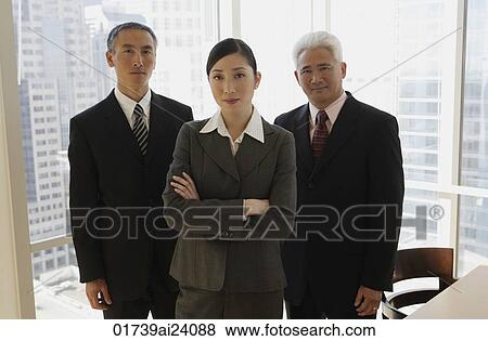 Stock Photo - three business people standing. Fotosearch