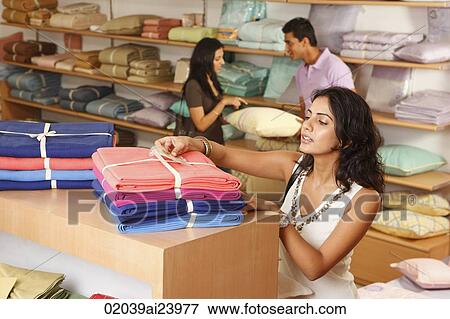 three people shopping for household items View Large Photo Image Stock Photo - three people shopping for household items. Fotosearch