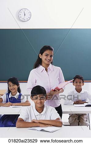 three students and their teacher View Large Photo Image Stock Photo - three students and their teacher. Fotosearch