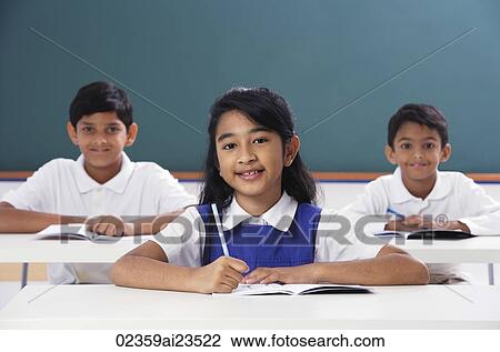 Stock Image - three students smile at camera, girl in center. Fotosearch