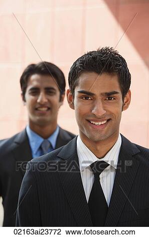 two businessmen smiling (vertical) View Large Photo Image Stock Image - two businessmen smiling (vertical). Fotosearch