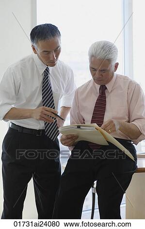 two businessmen talking View Large Photo Image Stock Image - two businessmen talking. Fotosearch
