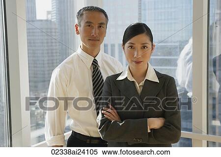 two colleagues standing in window View Large Photo Image Stock Photography - two colleagues standing in window. Fotosearch