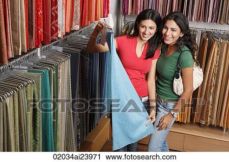 two girls shopping for fabric View Large Photo Image Stock Image - two girls shopping for fabric. Fotosearch