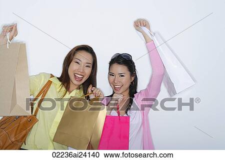 two woman with shopping bags View Large Photo Image Stock Image - two woman with shopping bags. Fotosearch