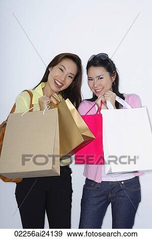 two woman with shopping bags View Large Photo Image Stock Photo - two woman with shopping bags. Fotosearch