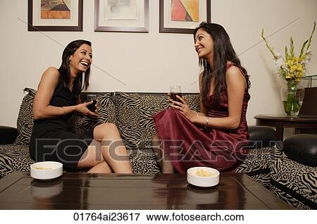 two women talking, drinks in hand (horizontal) View Large Photo Image Stock Photo - two women talking, drinks in hand (horizontal). Fotosearch