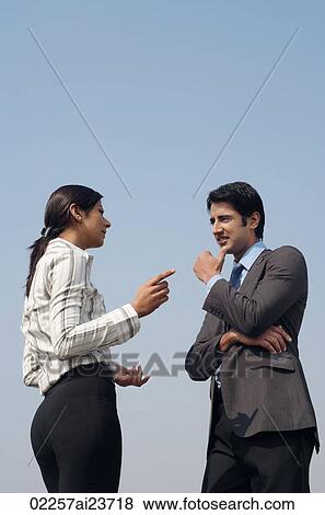 woman and man discussing business (vertical) View Large Photo Image Stock Photo - woman and man discussing business (vertical). Fotosearch