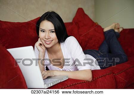 woman at laptop on couch View Large Photo Image Stock Photograph - woman at laptop on couch. Fotosearch