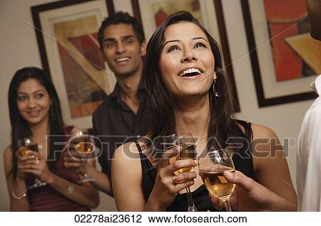 Stock Image - woman at party laughing. Fotosearch