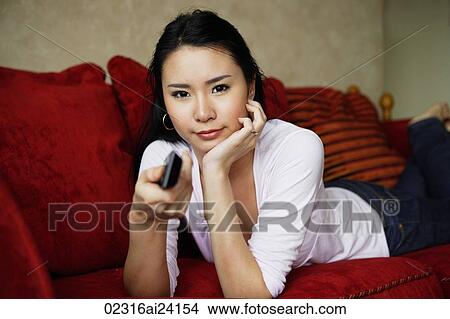 woman changing channels View Large Photo Image Picture - woman changing channels. Fotosearch