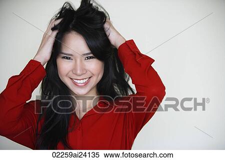 woman messing up her hair View Large Photo Image Stock Photography - woman messing up her hair. Fotosearch