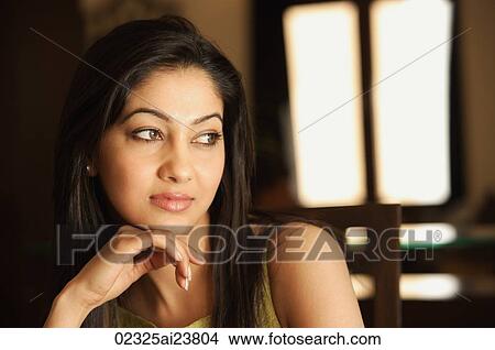 woman resting chin on hand (horizontal) View Large Photo Image Picture - woman resting chin on hand (horizontal). Fotosearch