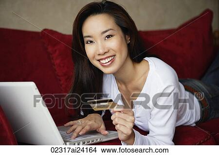 woman shopping online, on couch View Large Photo Image Picture - woman shopping online, on couch. Fotosearch