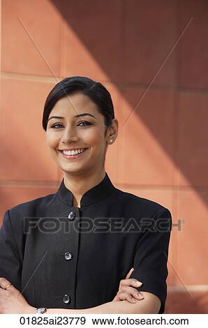 woman with arms crossed smiling at camera View Large Photo Image Stock Photo - woman with arms crossed smiling at camera. Fotosearch