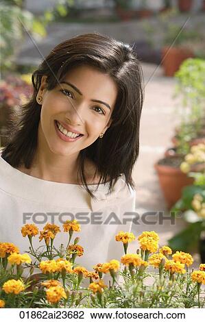 woman with flowers (vertical) View Large Photo Image Stock Image - woman with flowers (vertical). Fotosearch