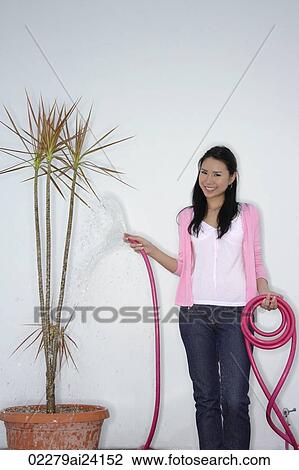 Stock Image - woman with pink hose. Fotosearch