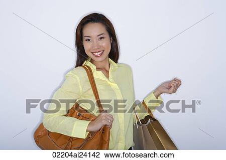 woman with purse and shopping bags View Large Photo Image Stock Image - woman with purse and shopping bags. Fotosearch