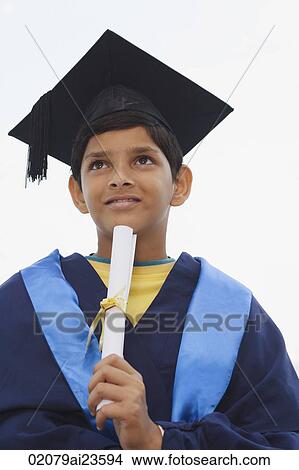 young boy graduate with diploma on chin View Large Photo Image Picture - young boy graduate with diploma on chin. Fotosearch