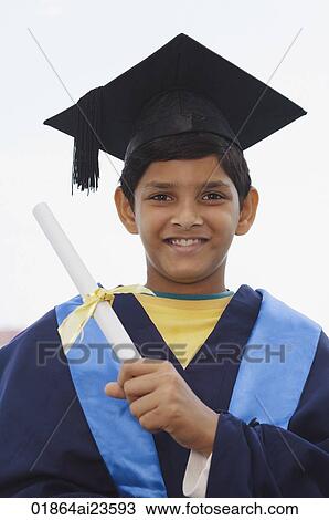 Stock Image - young boy graduate with diploma. Fotosearch