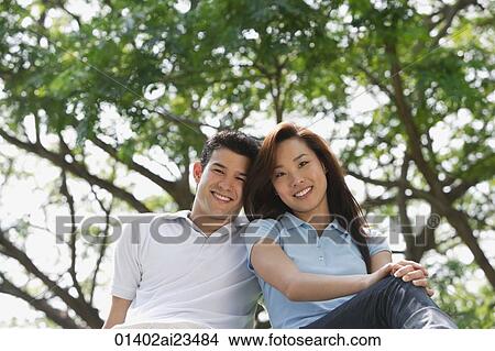 Picture - Young couple at the park. Fotosearch