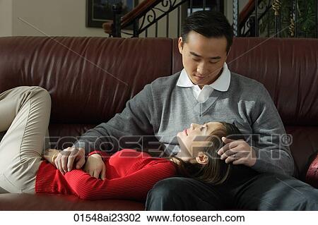 Young couple looking lovingly at each other View Large Photo Image Stock Image - Young couple looking lovingly at each other. Fotosearch