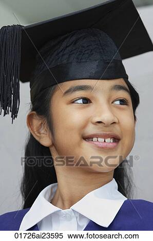 Stock Photography - young girl graduate smiling. Fotosearch