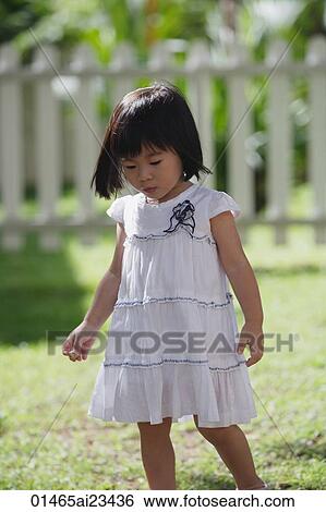 Young girl in backyard View Large Photo Image Stock Photograph - Young girl in backyard. Fotosearch