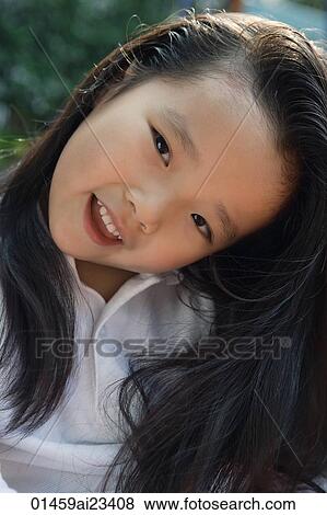 Young girl looking at camera View Large Photo Image Stock Photo - Young girl looking at camera. Fotosearch