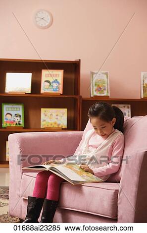 Young girl reading a book View Large Photo Image Stock Photography - Young girl reading a book. Fotosearch