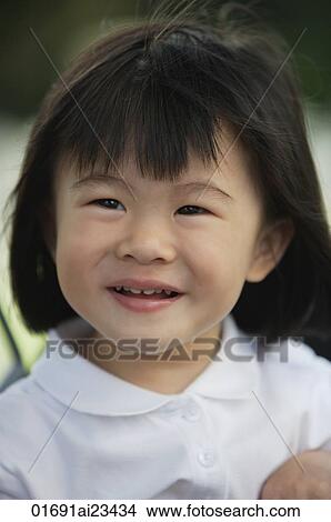 Picture - Young girl smiling. Fotosearch