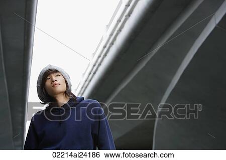 young man in hat, looking up View Large Photo Image Stock Photograph - young man in hat, looking up. Fotosearch