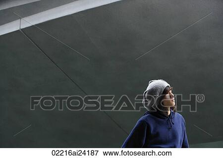 Stock Photo - young man in hat, profile. Fotosearch