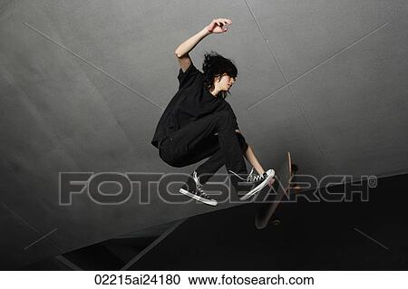 young man in mid air with skateboard View Large Photo Image Stock Image - young man in mid air with skateboard. Fotosearch