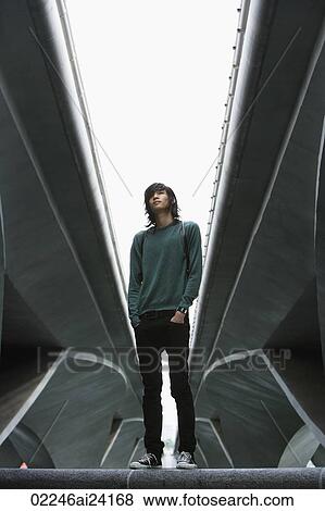 young man standing under freeway overpass View Large Photo Image Stock Photo - young man standing under freeway overpass. Fotosearch