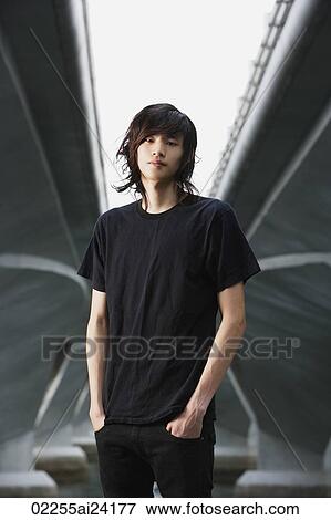 Stock Photo - young man with hands in pockets. Fotosearch
