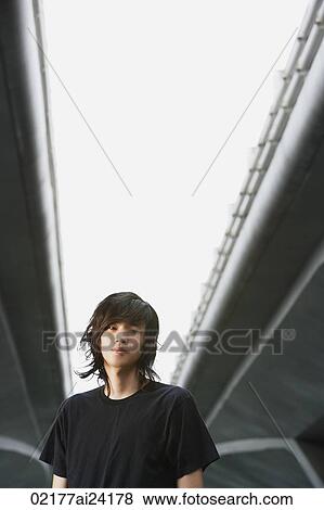 Stock Photo - young man with long hair. Fotosearch