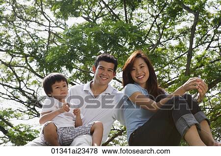 Young parents with son at the park View Large Photo Image Stock Photo - Young parents with son at the park. Fotosearch