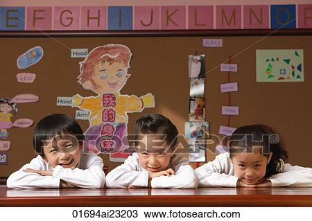 Young students in class View Large Photo Image Stock Image - Young students in class. Fotosearch