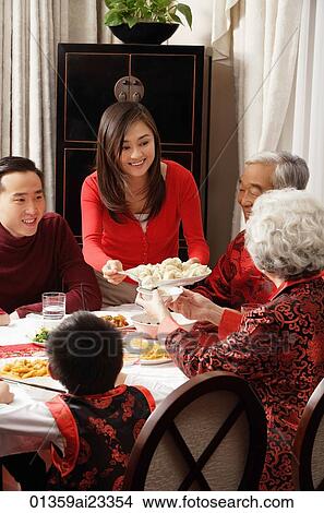 Young woman dishing food View Large Photo Image Picture - Young woman dishing food. Fotosearch
