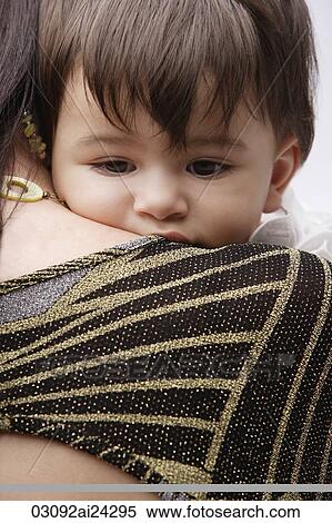 baby boy on mother's shoulder View Large Photo Image Stock Photography - baby boy on mother's shoulder. Fotosearch