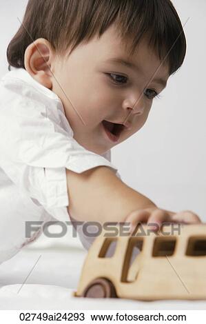 baby boy playing with toy auto View Large Photo Image Stock Image - baby boy playing with toy auto. Fotosearch