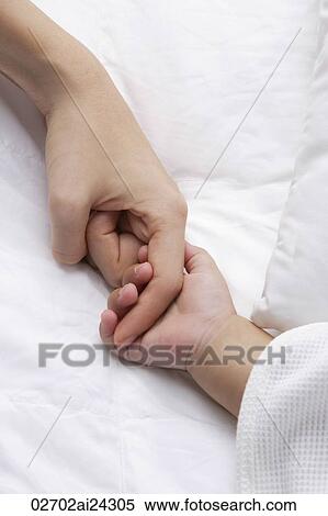 baby's hand holding mother's finger View Large Photo Image Stock Photography - baby's hand holding mother's finger. Fotosearch
