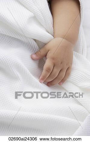 Stock Photograph - baby's hand. Fotosearch