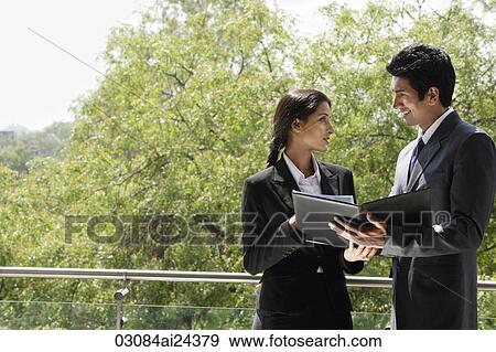business associates having discussion View Large Photo Image Stock Photo - business associates having discussion. Fotosearch