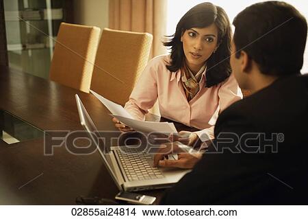 business associates having meeting, laptop computer View Large Photo Image Picture - business associates having meeting, laptop computer. Fotosearch