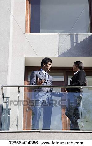 business associates speaking on balcony View Large Photo Image Stock Photograph - business associates speaking on balcony. Fotosearch